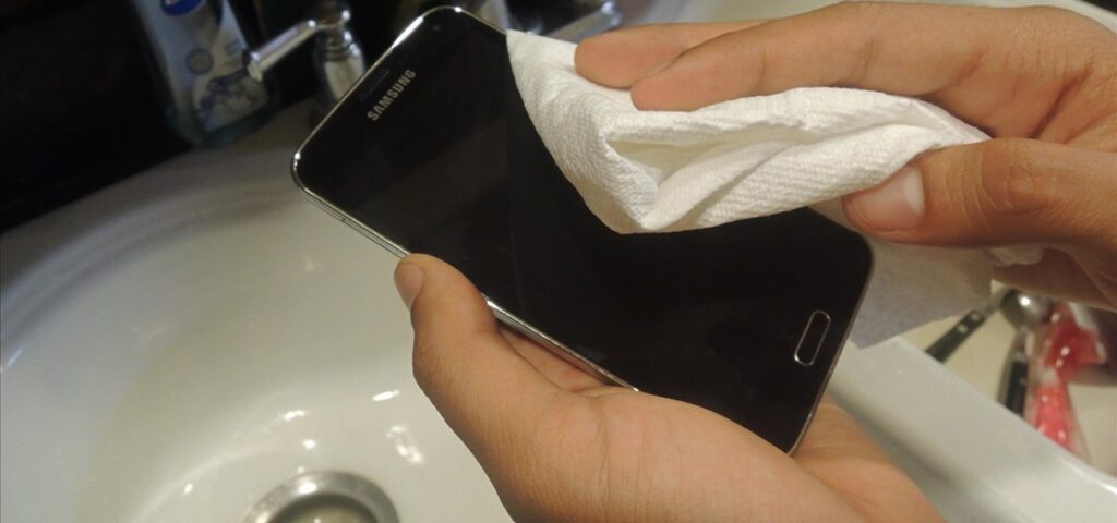 Dry out phone using a paper towel